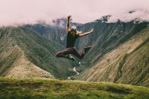 Girl jumping with energy in nature